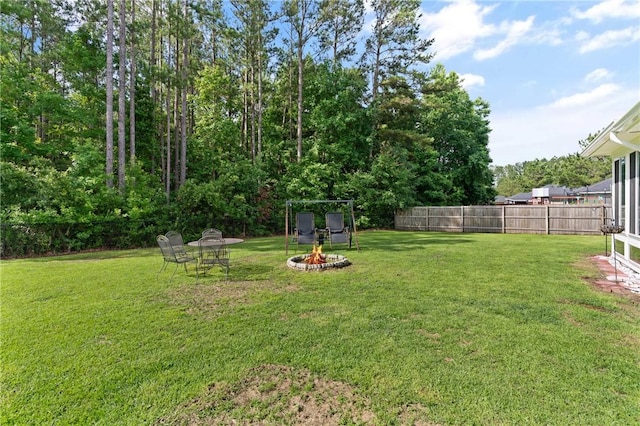 1067 Tidal Dr SE, Townsend, GA 31331 - view of yard featuring an outdoor fire pit