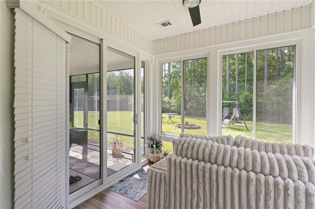 1067 Tidal Dr SE, Townsend, GA 31331 - sunroom / solarium with radiator heating unit and wood finished floors