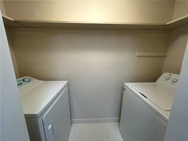 laundry area featuring washer and dryer, laundry area, and baseboards