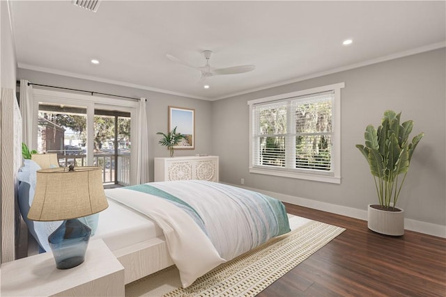 bedroom featuring ceiling fan, dark hardwood / wood-style flooring, access to outside, and multiple windows