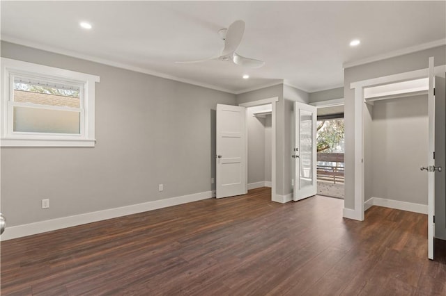 unfurnished bedroom with access to outside, crown molding, ceiling fan, dark hardwood / wood-style floors, and a closet