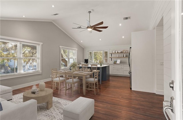 interior space featuring dark hardwood / wood-style flooring, high vaulted ceiling, and ceiling fan