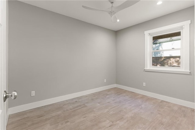 empty room featuring ceiling fan and light hardwood / wood-style floors