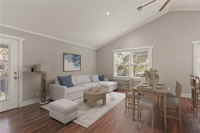 living room with lofted ceiling, a healthy amount of sunlight, and dark hardwood / wood-style floors