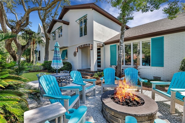 1626 Bruce Dr, Saint Simons Island, GA 31522 - view of patio / terrace featuring a fire pit