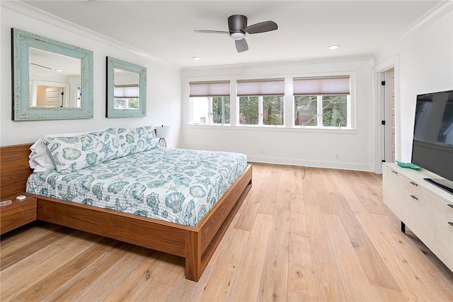 1626 Bruce Dr, Saint Simons Island, GA 31522 - bedroom featuring crown molding, baseboards, light wood-type flooring, and ceiling fan