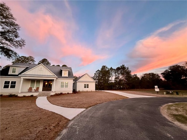 view of front of property with covered porch and board and batten siding