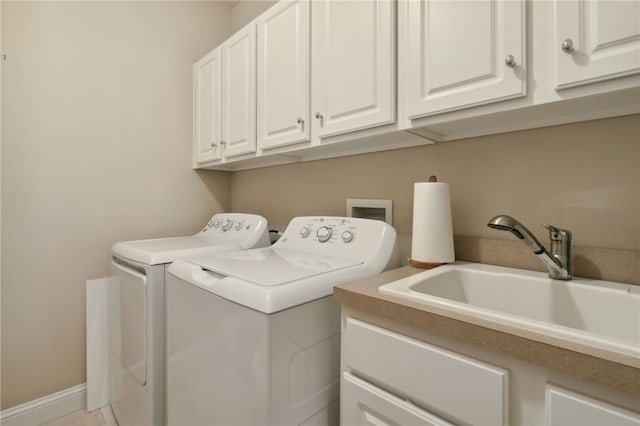 2491 Isles Of St Marys Way, Saint Marys, GA 31558 - laundry room with washer and clothes dryer and cabinet space