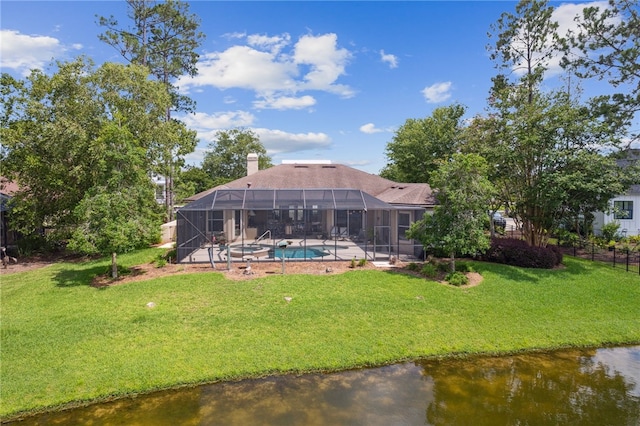 2491 Isles Of St Marys Way, Saint Marys, GA 31558 - rear view of property with an outdoor pool, a lawn, a patio area, and glass enclosure