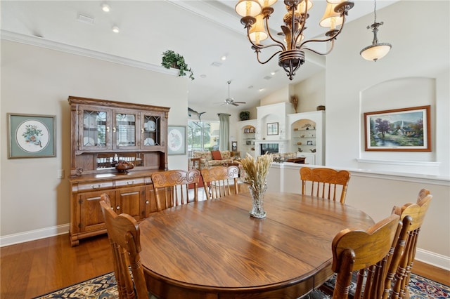 2491 Isles Of St Marys Way, Saint Marys, GA 31558 - dining space with wood finished floors, a chandelier, vaulted ceiling, and a ceiling fan