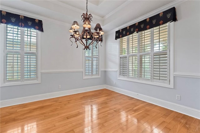 151 Raymonds Grant Trce, Saint Simons Island, GA 31522 - unfurnished dining area with healthy amount of natural light, a chandelier, wood finished floors, and crown molding