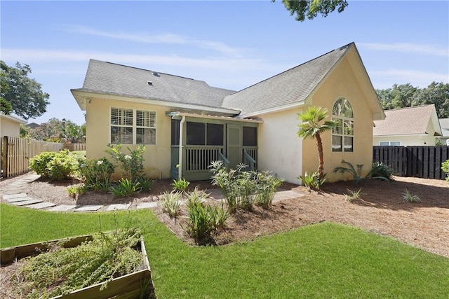 151 Raymonds Grant Trce, Saint Simons Island, GA 31522 - rear view of property featuring stucco siding, a garden, and a shingled roof
