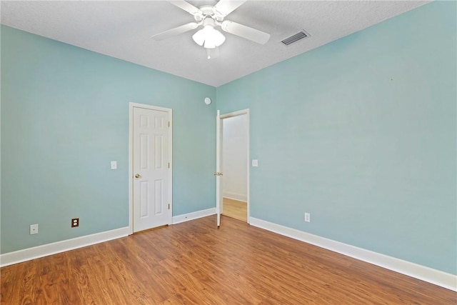 151 Raymonds Grant Trce, Saint Simons Island, GA 31522 - unfurnished bedroom featuring wood finished floors and ceiling fan