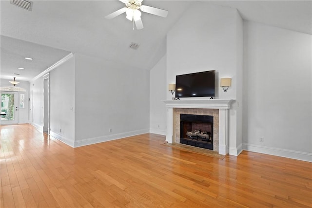 151 Raymonds Grant Trce, Saint Simons Island, GA 31522 - unfurnished living room featuring light wood-style floors, ceiling fan, a tile fireplace, and high vaulted ceiling