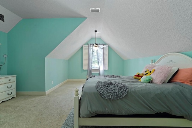 151 Raymonds Grant Trce, Saint Simons Island, GA 31522 - bedroom featuring lofted ceiling, carpet, and a textured ceiling