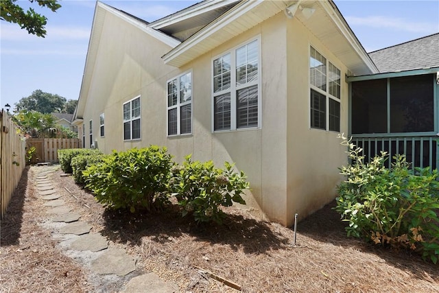 151 Raymonds Grant Trce, Saint Simons Island, GA 31522 - view of home's exterior with stucco siding and roof with shingles