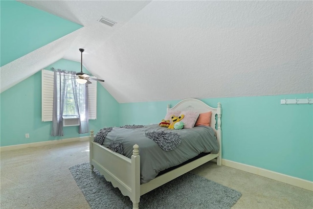 151 Raymonds Grant Trce, Saint Simons Island, GA 31522 - bedroom with lofted ceiling, carpet flooring, and a textured ceiling