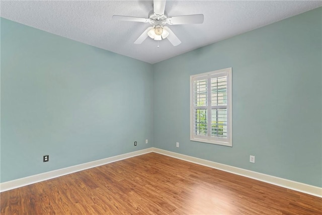 151 Raymonds Grant Trce, Saint Simons Island, GA 31522 - unfurnished room with wood finished floors, a textured ceiling, and a ceiling fan