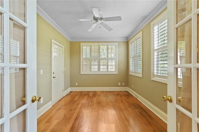 151 Raymonds Grant Trce, Saint Simons Island, GA 31522 - spare room with light wood-type flooring, a textured ceiling, healthy amount of natural light, ornamental molding, and a ceiling fan