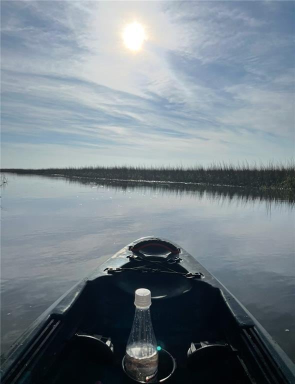 property view of water with a dock