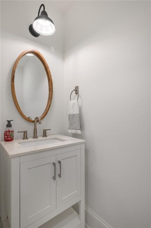 bathroom featuring vanity and baseboards