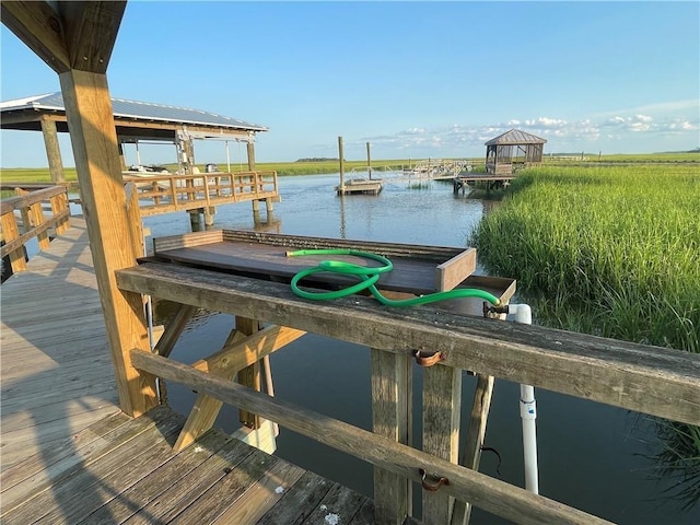 dock area featuring a water view