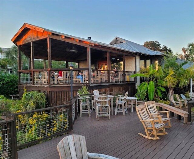 wooden terrace with outdoor dining area