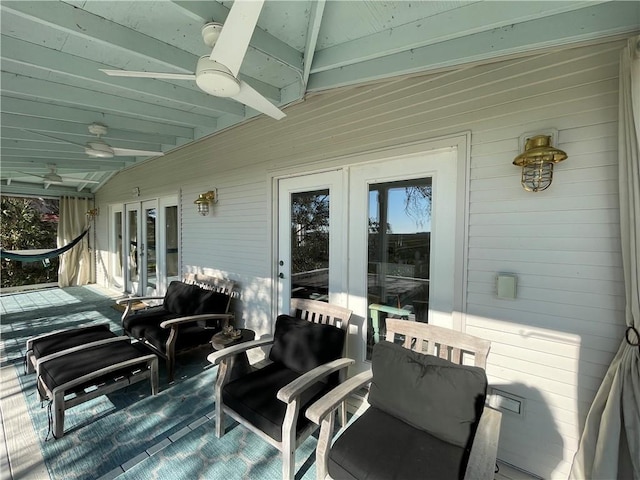 deck with french doors and ceiling fan