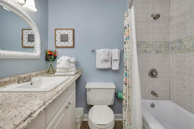 full bathroom featuring vanity, shower / bath combination with curtain, and toilet