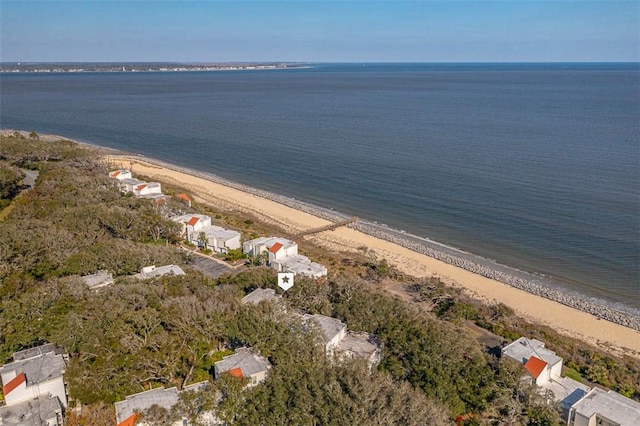 drone / aerial view with a water view and a beach view