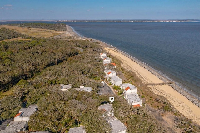 birds eye view of property featuring a view of the beach and a water view