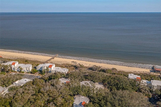 bird's eye view featuring a water view and a beach view