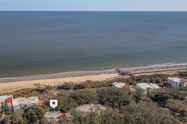 birds eye view of property with a water view and a view of the beach