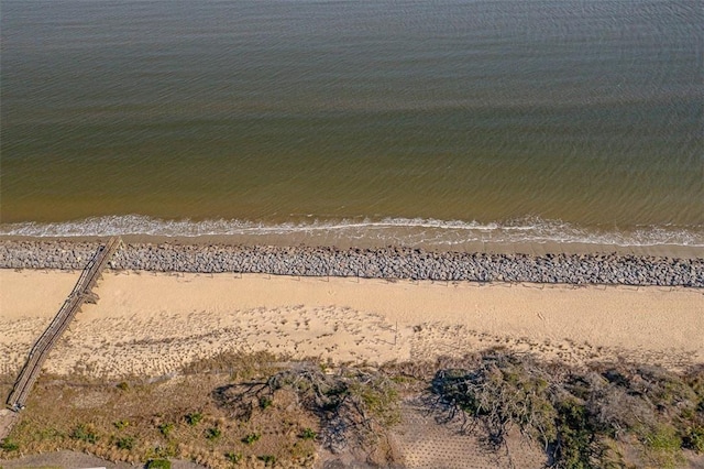 bird's eye view featuring a water view and a view of the beach