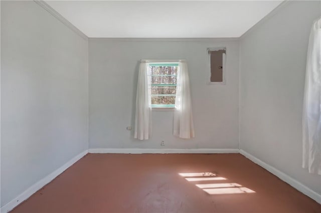 unfurnished room featuring electric panel and baseboards