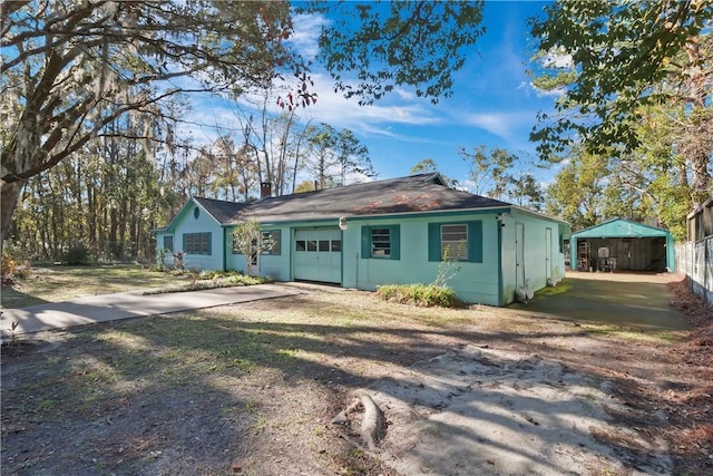 view of front of home with a garage and concrete driveway