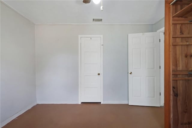 unfurnished bedroom featuring concrete flooring, visible vents, ceiling fan, and baseboards