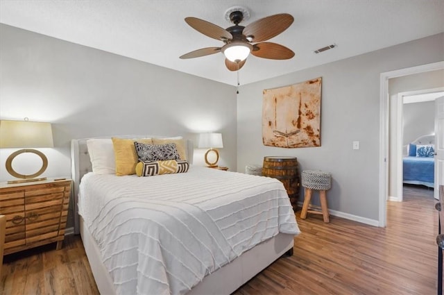 bedroom featuring hardwood / wood-style floors and ceiling fan