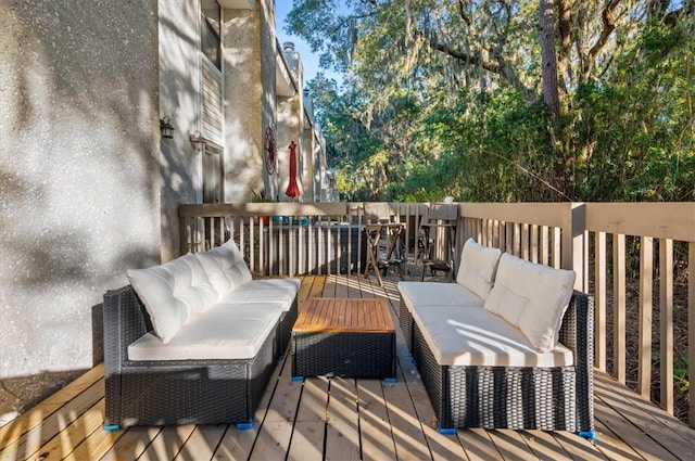 wooden terrace with outdoor lounge area