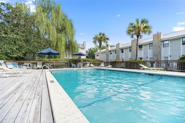 view of swimming pool featuring a deck