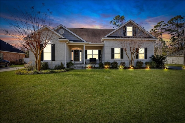 view of front of home with a lawn