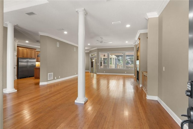 unfurnished living room featuring ornate columns, ceiling fan, visible vents, and light wood-style floors