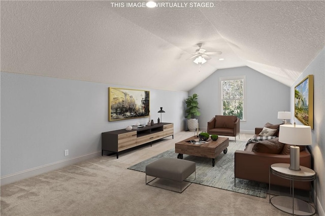 carpeted living area featuring ceiling fan, baseboards, vaulted ceiling, and a textured ceiling