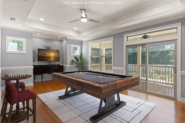 rec room featuring pool table, wainscoting, a raised ceiling, and a healthy amount of sunlight