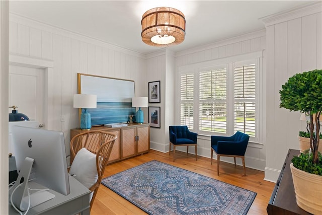 office featuring light wood-type flooring and crown molding