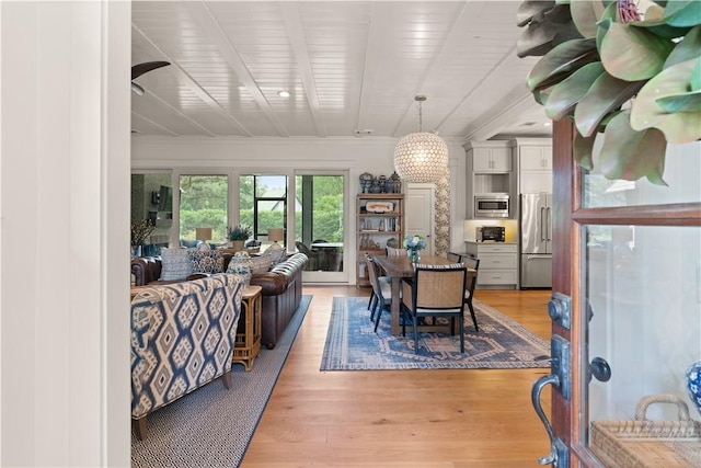 dining space with light hardwood / wood-style flooring