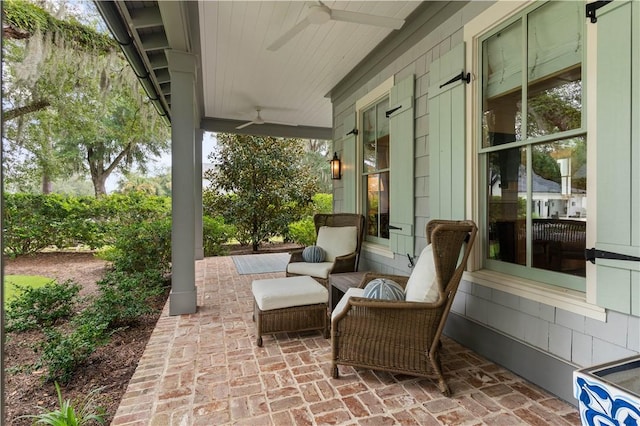 view of patio with ceiling fan and a porch