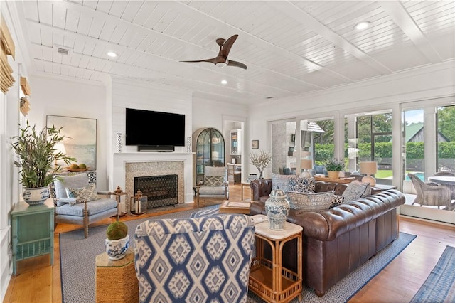 living room featuring light wood-type flooring, ceiling fan, and wooden ceiling