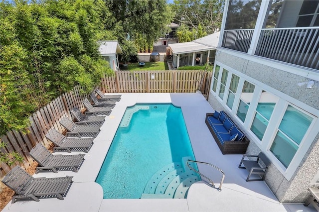 view of swimming pool with a patio