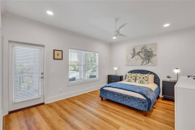 bedroom featuring hardwood / wood-style flooring, ceiling fan, access to exterior, and crown molding